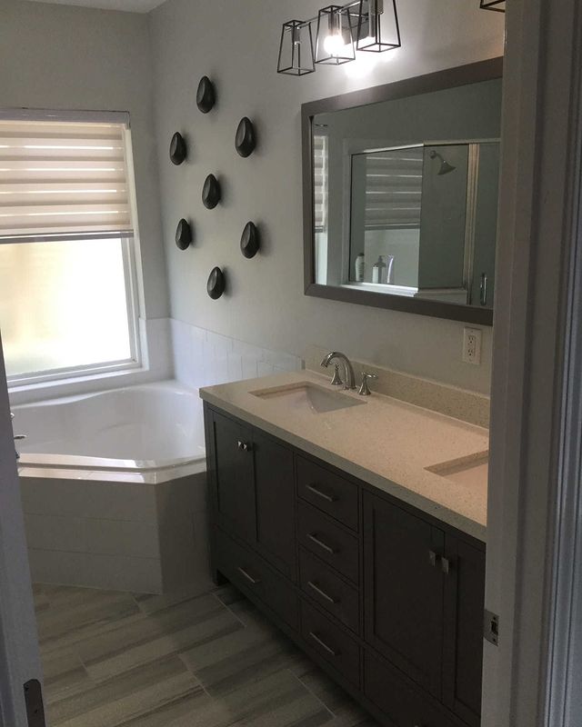 Stunning transformation of Bathroom, with new tiles, and elegant mirrors.