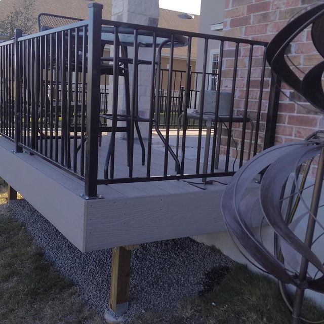 Outdoor deck with railing.