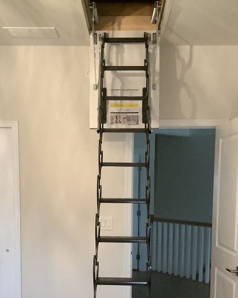 Retractable drop down ladder for attic.