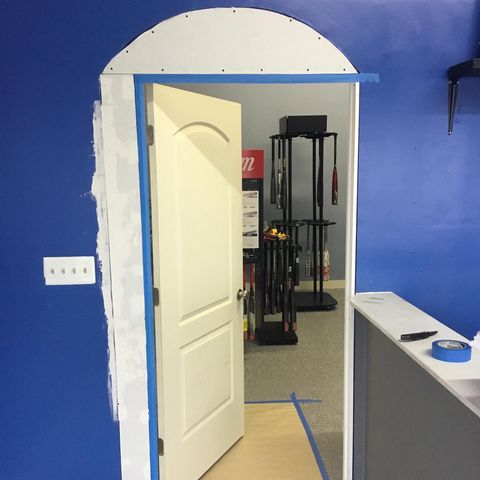 Blue drywall with white door.