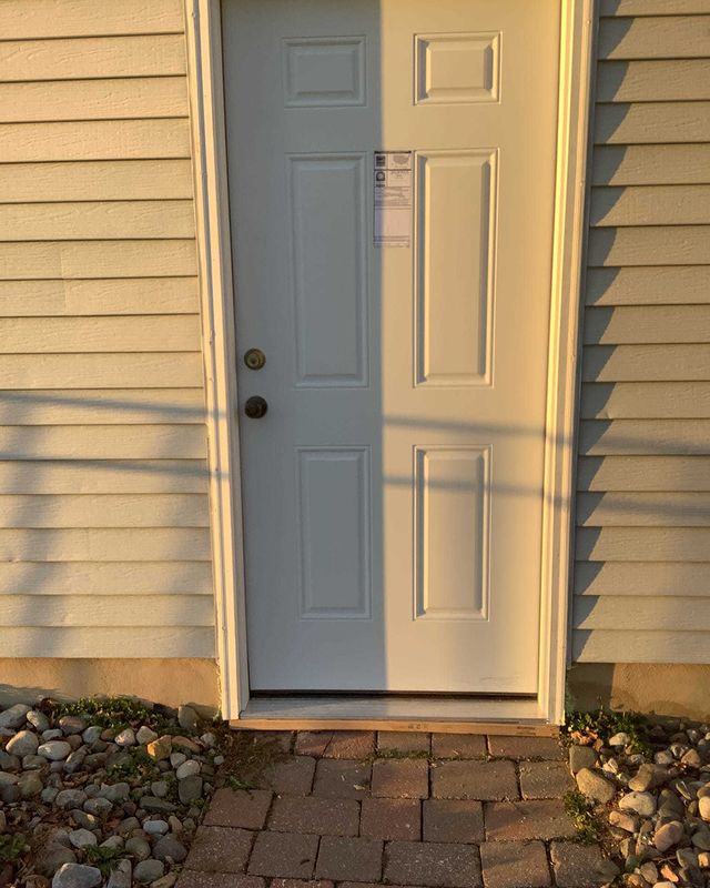 Exterior white door installation