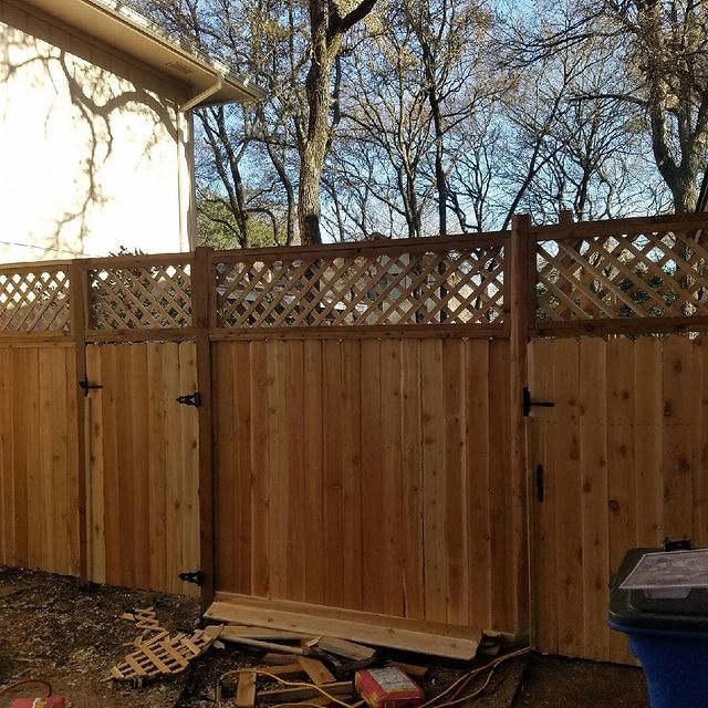 Outdoor wooden fence with gate.