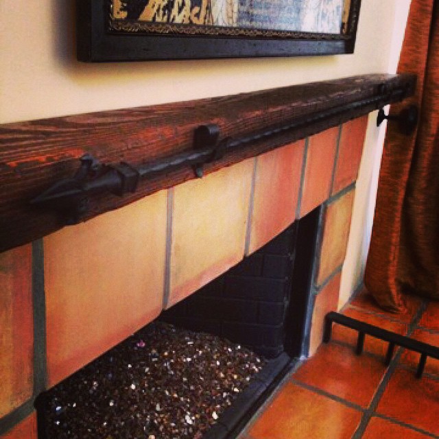 Custom brown fireplace mantle.