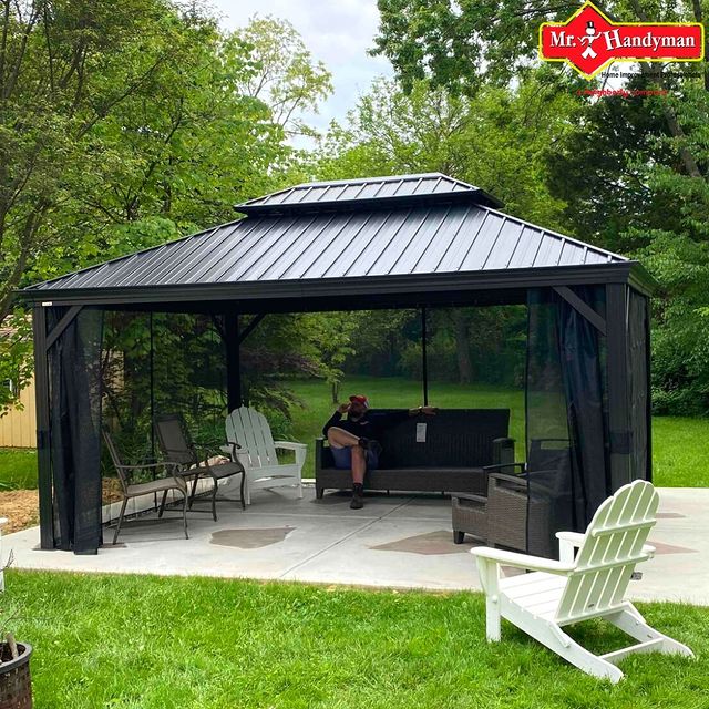 New black gazebo in a backyard