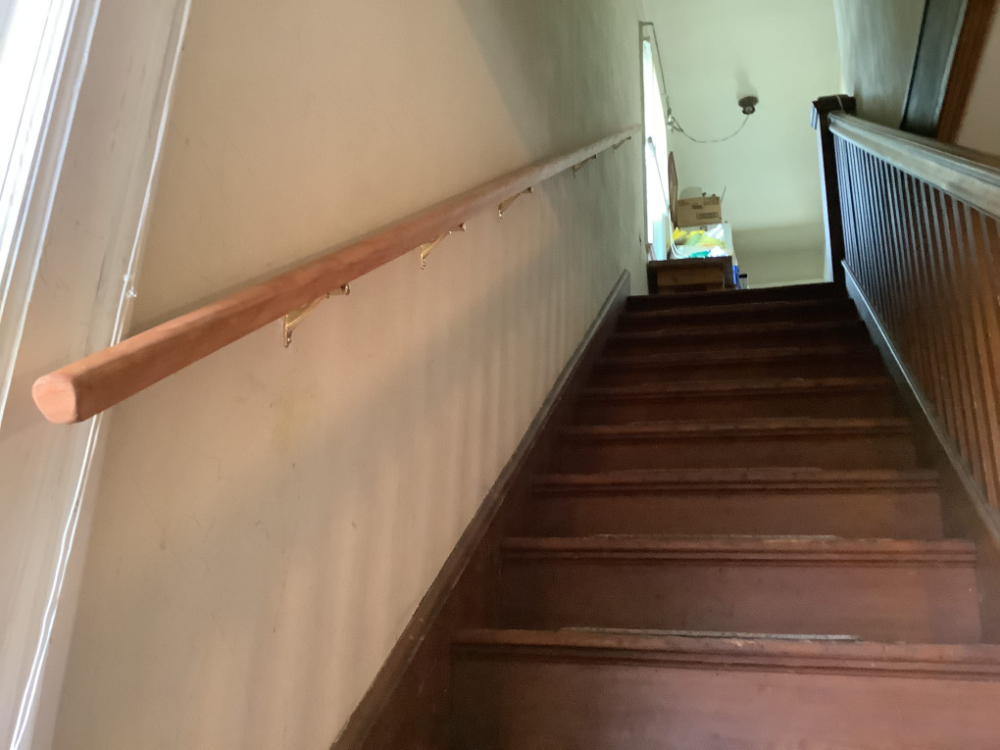 Handrail installed on left side of stairs