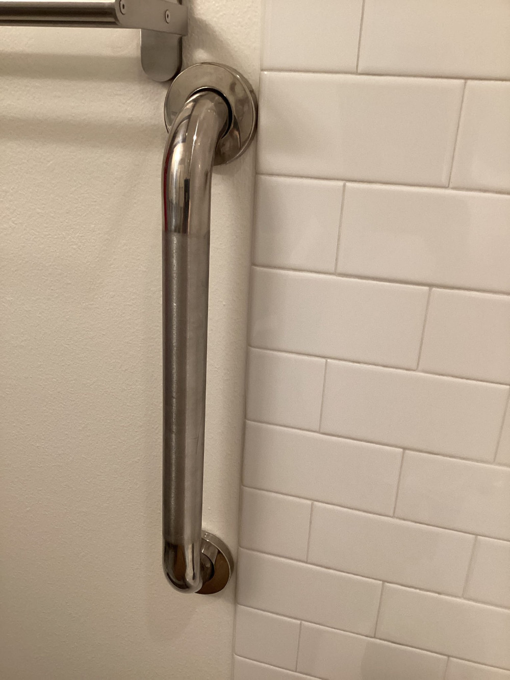 Installed hand rail for towel rack