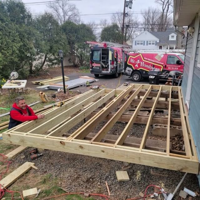 Handyman working on deck foundation