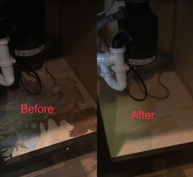 Kitchen plumbing under the sink cabinet.