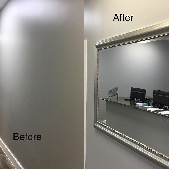 large mirror hanging on wall