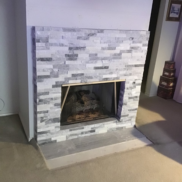 Results of a project to build a grey brick fireplace.