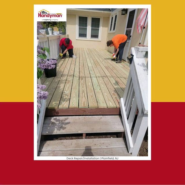 Two handymen working on deck