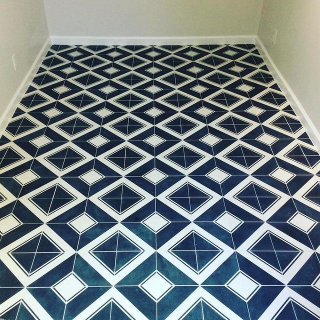 Blue and white diamond shaped tile flooring.