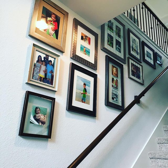 Stairway with photo gallery on the wall.