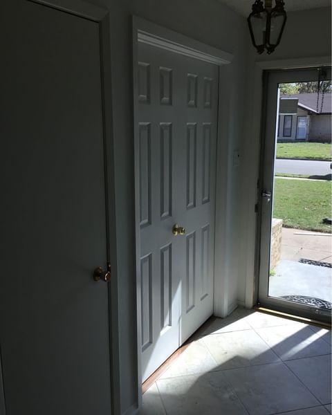 white french door in entry way