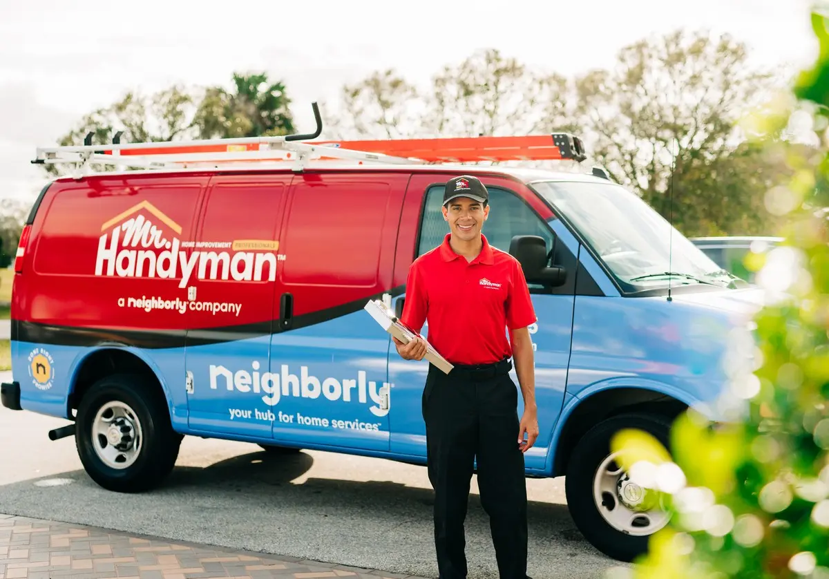 Mr. Handyman tech ready to perform home repairs in one of many service locations.