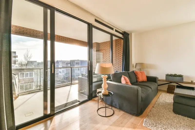 A home with a four-panel sliding glass door.