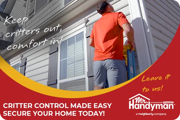 Handyman inspecting the outside of a house.