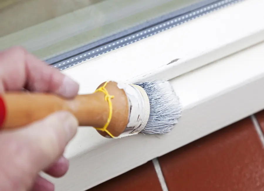 Prepare for painting window trim by priming