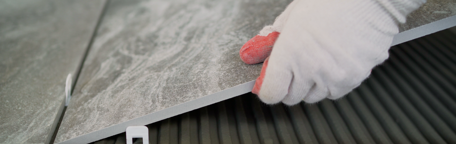 A floor tile being installed