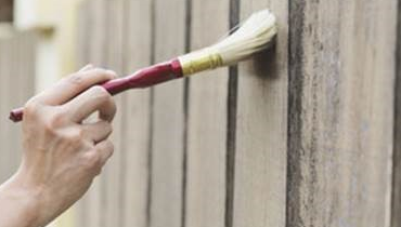 fence with paintbrush