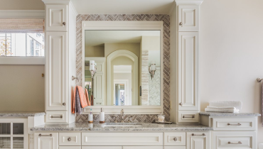 A large bathroom vanity with many cabinets and cupboards installed during a bathroom remodeling project.