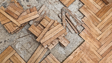 A wood floor that has been partially torn up in order to complete floor repairs in Knoxville, TN.