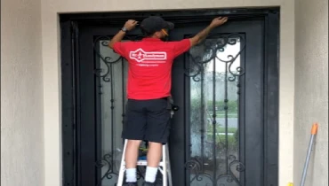 An MRH Technician fixing a door.