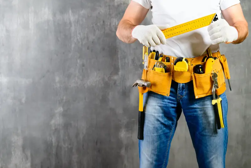 handyman wearing work belt.