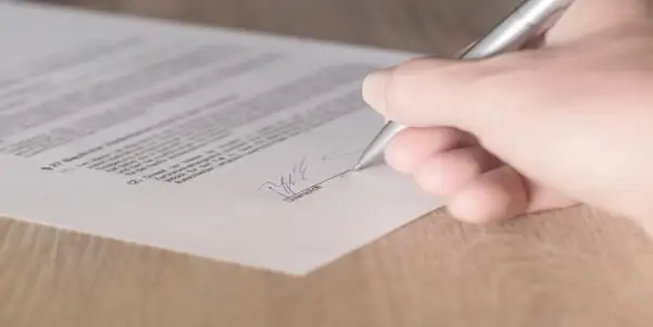 Person signing a contract