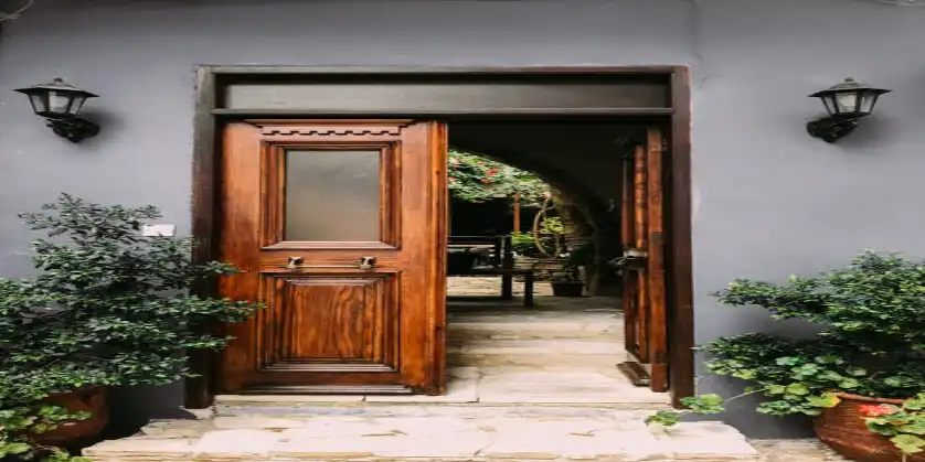 A wooden door with a glass panel.