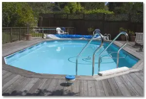 A swimming pool with a deck.