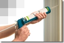 Applying Caulk to a Window Frame.