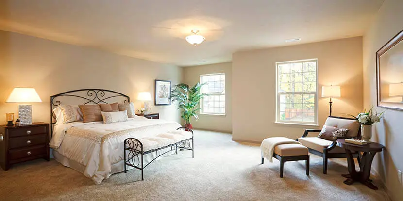 Bedroom with a white bed.