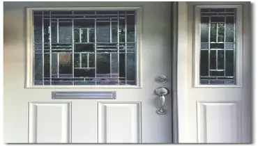 White front door with glass panel.