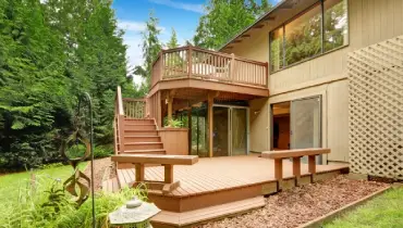 A house with a deck and a large patio.