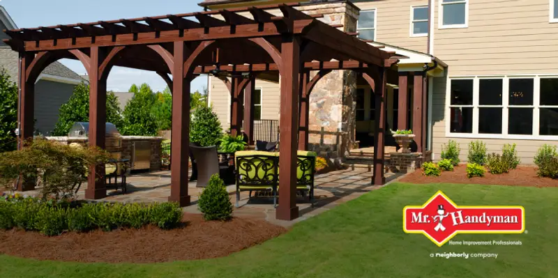 Backyard patio cover with green lawn.