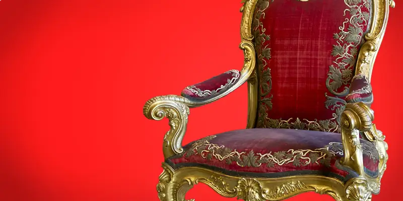 Stuffed chair against a red background