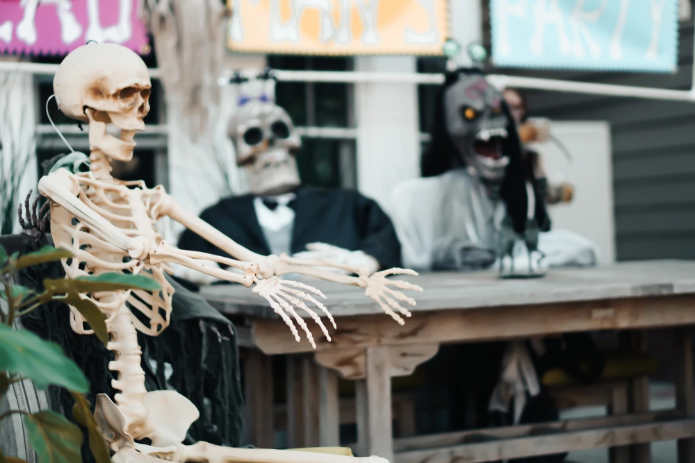 House with creepy halloween skeletons decorations.