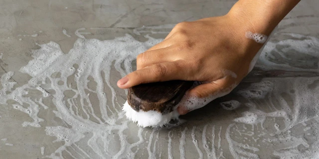 Scrubbing on a concrete surface.