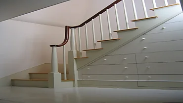 stairwell with drawer storage underneath.