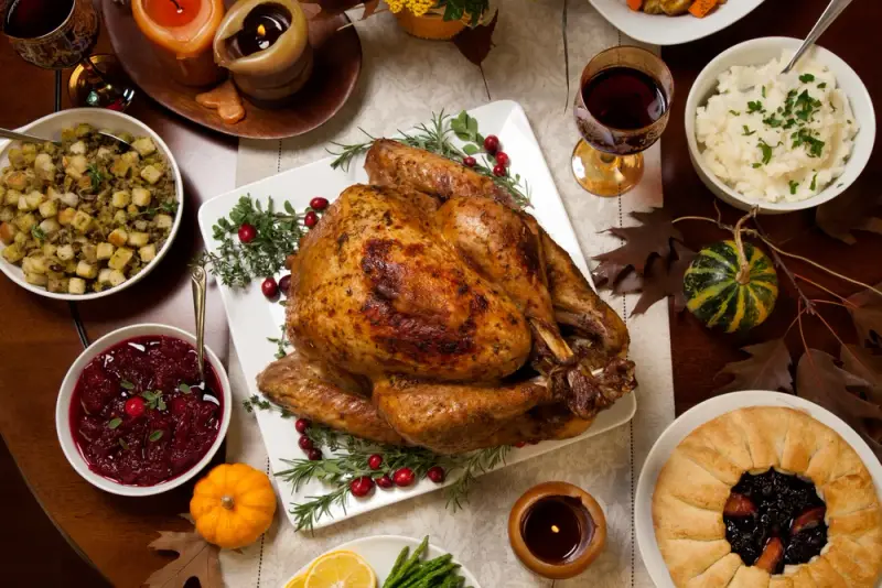 Thanksgiving table with traditional foods.