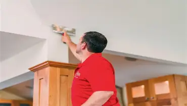 Mr. Handyman working on Drywall repairs
