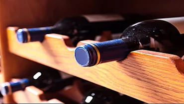 Wine in wooden wine rack.