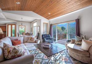 Living area with high, wood ceilings