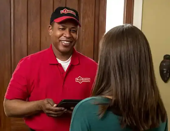 A Mr. Handyman Charleston technician speaking with a client.