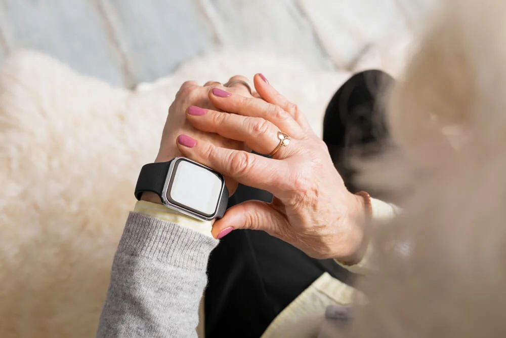 Woman looking at smartwatch.