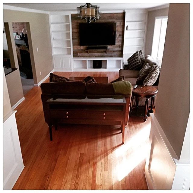 living area with tv mounted on wall.