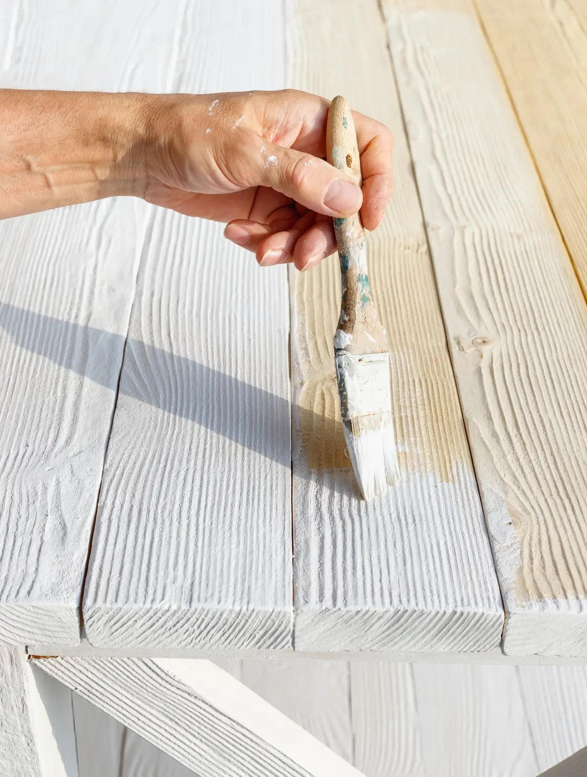 Mr. Handyman of Wheaton employee painting wood.