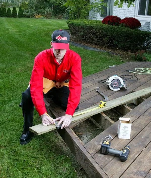  Mr. Handyman technician performing deck repair service in Columbia, MD.