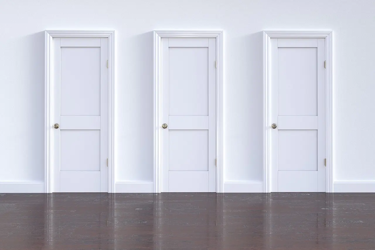 Three white doors next to each other that have been kept in good condition with professional door repairs in Charleston, SC.